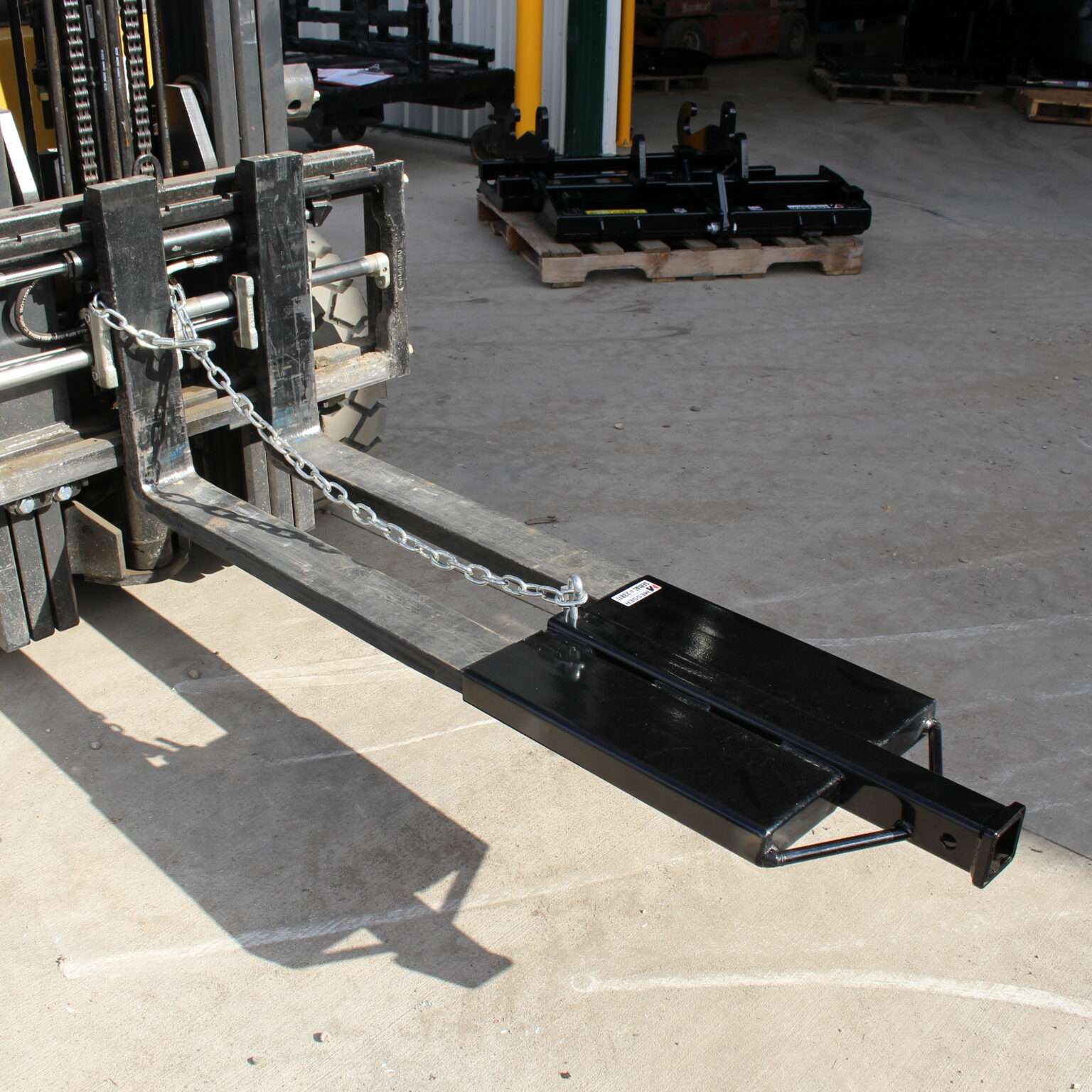 Side view of the Messer Attachments Fork Hitch Mover mounted on a forklift.